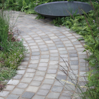 Luxury Garden Path Made With Cobblestone Pewter Paving Slabs Surrounded By Grass