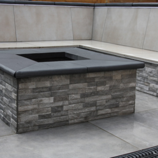Carbon Black Bullnose Coping for Fire Pit