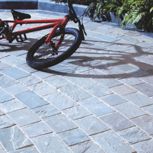 Bike Resting On Natural Paving Cinder Block Patio Bricks